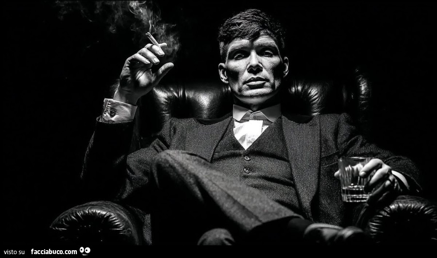 Seduto con alcool e sigaretta