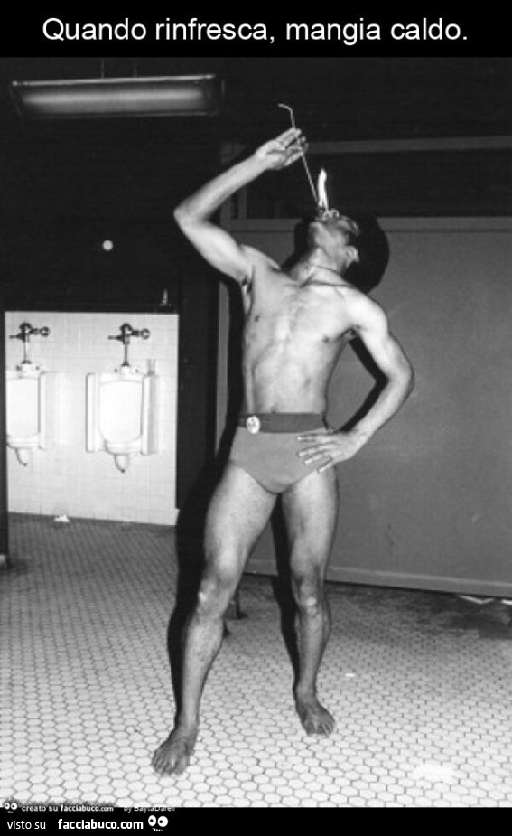 Quando rinfresca, mangia caldo. Mangiatore di fuoco. Photo Arlene Gottfried, 1978